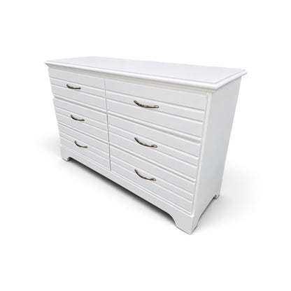 Angled view of used white 6-drawer bedroom dresser with curved feet, SHL.
