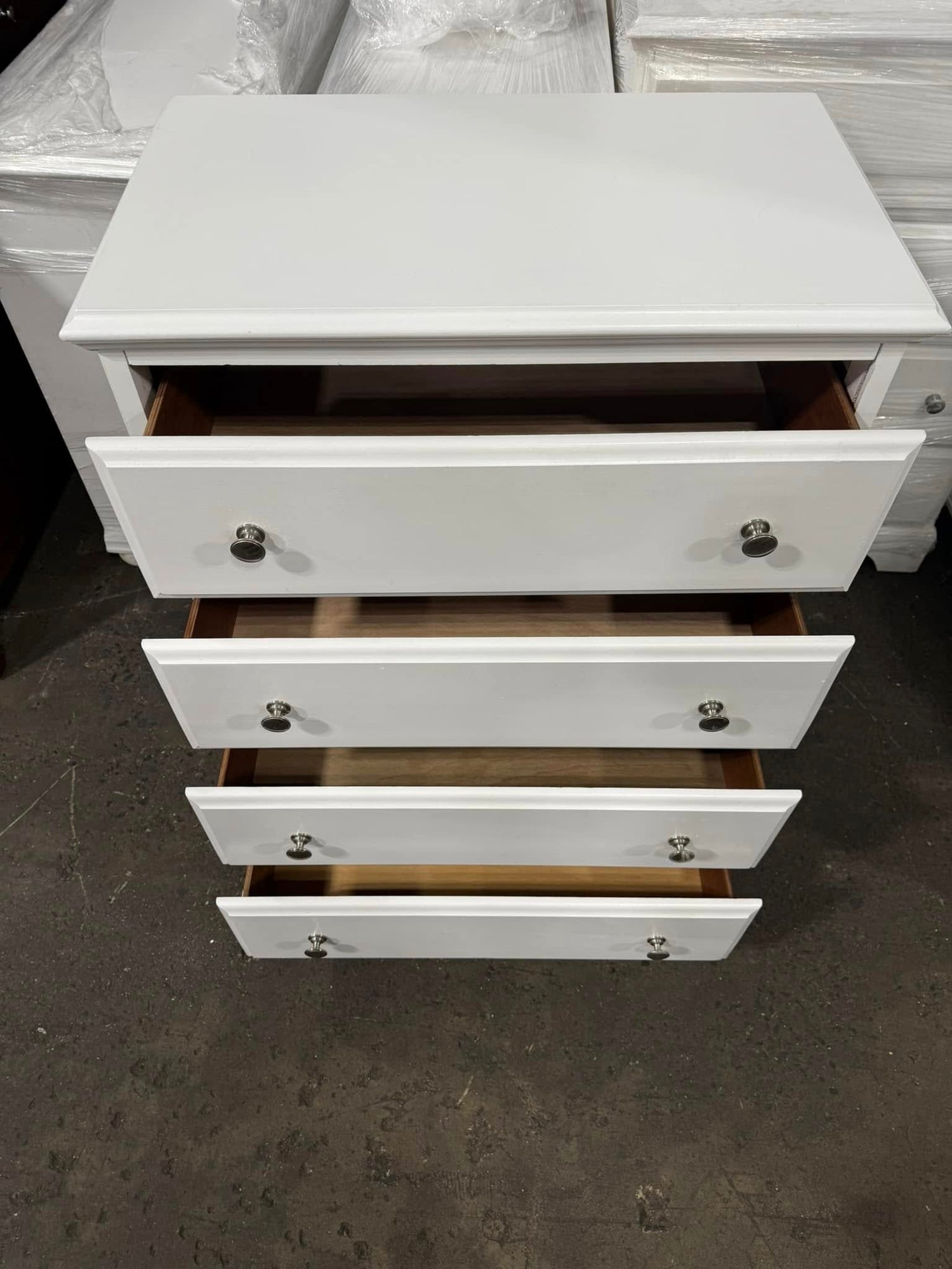 White 4-drawer chest with drawers open, coastal farmhouse furniture style