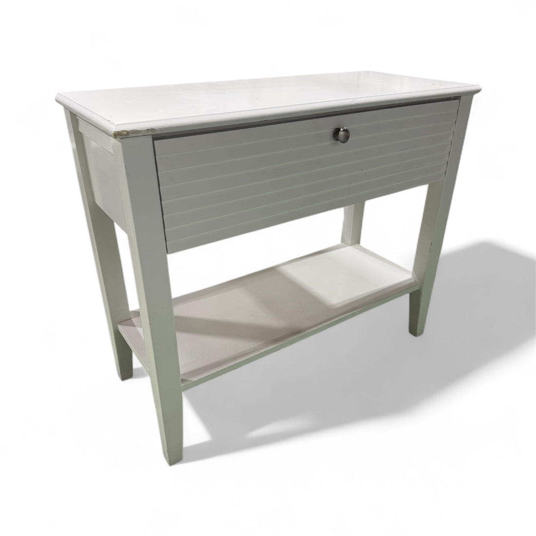 “White entry table with shutter-look front and one drawer, coastal or farmhouse style, used and in very good condition, sourced from a coastal resort”
