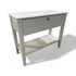 “White entry table with shutter-look front and one drawer, coastal or farmhouse style, used and in very good condition, sourced from a coastal resort”